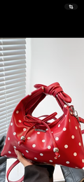 Red and white polka dotted purse